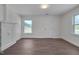 Bright bedroom featuring new floors, fresh white walls, and natural light at 414 Craven St, Durham, NC 27704