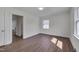 Bedroom features two windows and vinyl floors at 414 Craven St, Durham, NC 27704