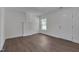 Cozy bedroom with new hardwood floors, fresh paint, and a decorative fireplace at 414 Craven St, Durham, NC 27704