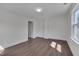 Spacious bedroom with wood floors, neutral colors, and good natural light at 414 Craven St, Durham, NC 27704