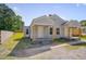 Well-maintained duplex with manicured lawn, showcasing individual entrances and fresh exterior paint at 414 Craven St, Durham, NC 27704