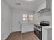 Charming kitchen featuring white cabinets, stainless steel appliances, and modern fixtures at 414 Craven St, Durham, NC 27704