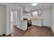 Bright kitchen featuring white cabinets, stainless steel appliances, and wooden countertops at 414 Craven St, Durham, NC 27704