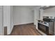Spacious kitchen area with modern stainless steel appliances and wood-look flooring at 414 Craven St, Durham, NC 27704