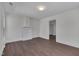 Bright living room featuring new hardwood floors, fresh paint, and a fireplace mantle at 414 Craven St, Durham, NC 27704