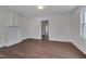 Bright living room featuring new hardwood floors, fresh paint, a fireplace and natural light at 414 Craven St, Durham, NC 27704