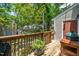 Back deck with railing, grill, and view of backyard at 4604 Townesbury Ln, Raleigh, NC 27612
