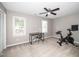 Bedroom with carpet, ceiling fan, and windows providing natural light at 4604 Townesbury Ln, Raleigh, NC 27612