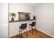 Charming breakfast bar with seating provides a cozy spot for casual dining and connects seamlessly to the kitchen at 4604 Townesbury Ln, Raleigh, NC 27612