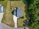 Aerial view of the house showing backyard, play set, and lush green surroundings at 486 S Denise Ave, Coats, NC 27521