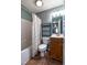 Bathroom with tub/shower combo with polka dot shower curtain at 486 S Denise Ave, Coats, NC 27521