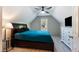 Bedroom features a ceiling fan, window with natural light, and a white dresser at 486 S Denise Ave, Coats, NC 27521