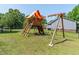 Wooden outdoor play set with swings, slide, ladder and clubhouse at 486 S Denise Ave, Coats, NC 27521