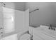 All-white bathroom featuring a shower-tub combo and updated vanity at 508 Buena Vista Ave, Rocky Mount, NC 27801