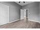Bedroom offers wood-look floors, a closet, and ensuite bathroom access at 508 Buena Vista Ave, Rocky Mount, NC 27801