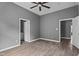Spacious bedroom with wood-look floors, ceiling fan and ensuite bathroom access at 508 Buena Vista Ave, Rocky Mount, NC 27801