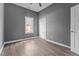 Cozy bedroom has wood-look floors, a closet, and one window for natural light at 508 Buena Vista Ave, Rocky Mount, NC 27801
