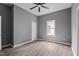 The bedroom includes a ceiling fan, modern vinyl plank flooring, and neutral-toned walls at 508 Buena Vista Ave, Rocky Mount, NC 27801
