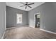 Large bedroom features wood-look floors, ceiling fan, and an ensuite bathroom at 508 Buena Vista Ave, Rocky Mount, NC 27801