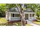 Charming home featuring a inviting porch, landscaped yard, and traditional architectural details at 508 Buena Vista Ave, Rocky Mount, NC 27801