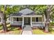 Charming home featuring a covered front porch with white columns and nicely landscaped yard at 508 Buena Vista Ave, Rocky Mount, NC 27801