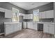 Corner view of new kitchen with new vinyl floor, counter tops, cabinets and windows at 508 Buena Vista Ave, Rocky Mount, NC 27801