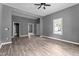 This open-concept living room features wood-look floors and plenty of natural light at 508 Buena Vista Ave, Rocky Mount, NC 27801