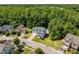 Neighborhood aerial view showcases the home, surrounding properties, and lush greenery at 513 Lake Gaston Dr, Fuquay Varina, NC 27526