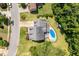 Aerial view of home showcasing pool, yard and proximity to neighborhood at 513 Lake Gaston Dr, Fuquay Varina, NC 27526