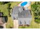 An aerial view of a house featuring a well-maintained roof, yard, and swimming pool at 513 Lake Gaston Dr, Fuquay Varina, NC 27526