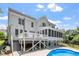 Gorgeous backyard featuring a deck, patio, in-ground pool, screened porch and fenced yard at 513 Lake Gaston Dr, Fuquay Varina, NC 27526