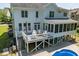 Expansive backyard featuring a deck, screened-in porch, and a swimming pool, perfect for outdoor entertaining at 513 Lake Gaston Dr, Fuquay Varina, NC 27526