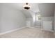 Neutral bedroom with a ceiling light, neutral walls and carpet, and storage closets at 513 Lake Gaston Dr, Fuquay Varina, NC 27526