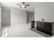 Spacious bonus room with wet bar, ceiling fan and carpeted floors at 513 Lake Gaston Dr, Fuquay Varina, NC 27526