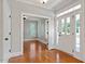 Charming foyer with hardwood floors, transom windows and a view of the adjacent living area at 513 Lake Gaston Dr, Fuquay Varina, NC 27526