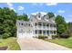 Beautiful white two-story home with double garage and a covered front porch at 513 Lake Gaston Dr, Fuquay Varina, NC 27526