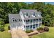 Charming white two-story home with a double porch and a well-manicured front yard at 513 Lake Gaston Dr, Fuquay Varina, NC 27526