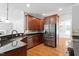Well-equipped kitchen featuring stainless steel appliances, granite countertops, and ample cabinetry at 513 Lake Gaston Dr, Fuquay Varina, NC 27526