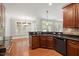 Open-concept kitchen with granite countertops and view into a sunny dining area at 513 Lake Gaston Dr, Fuquay Varina, NC 27526
