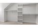 Spacious walk-in closet featuring open shelving and ample hanging space at 513 Lake Gaston Dr, Fuquay Varina, NC 27526