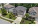 Beautiful aerial view of the gray two-story home, highlighting its mature trees and manicured lawn at 516 Culmore Dr, Fuquay Varina, NC 27526