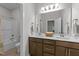Bathroom featuring double sink vanity, white countertops, and a mirror at 516 Culmore Dr, Fuquay Varina, NC 27526