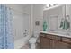 Bathroom with a bathtub/shower combination, white shower curtain and a vanity with a sink at 516 Culmore Dr, Fuquay Varina, NC 27526