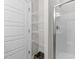 Bright bathroom showcasing a walk-in shower and a white storage shelving unit at 516 Culmore Dr, Fuquay Varina, NC 27526