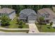 Stunning aerial shot of a well-maintained home with a green lawn and beautiful landscaping at 516 Culmore Dr, Fuquay Varina, NC 27526