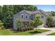 Landscaped two-story home featuring gray siding, a manicured lawn, and a two-car garage at 516 Culmore Dr, Fuquay Varina, NC 27526