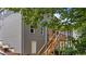 Back of house featuring exterior staircase leading to screened porch above basement entrance at 516 Culmore Dr, Fuquay Varina, NC 27526