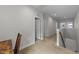 Carpeted hallway with white walls leading to rooms with white doors and trim at 516 Culmore Dr, Fuquay Varina, NC 27526