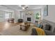 Spacious living room features hardwood floors, decorative fireplace, comfortable seating and natural light at 516 Culmore Dr, Fuquay Varina, NC 27526