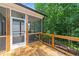 Exterior view of the home's screened porch featuring a screened door and wooden railing at 516 Culmore Dr, Fuquay Varina, NC 27526